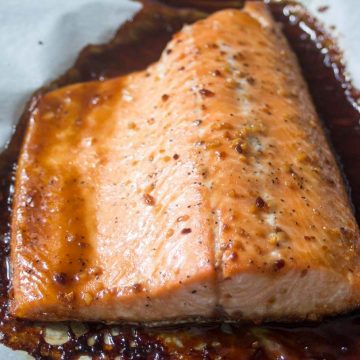 Honey Teriyaki salmon fillet on a baking sheet.
