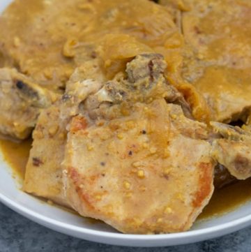 maple dijon pork chops served in a white plate