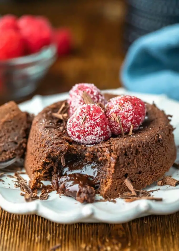 lava cake served on a plate decorated with raspberry