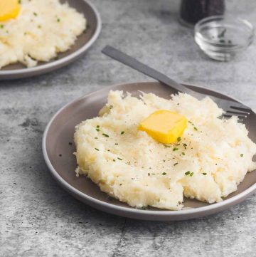 a plate served with yuca mash with butter and chives