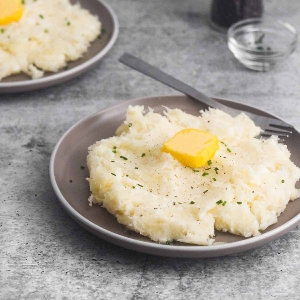 a plate served with mashed yuca with butter and chives