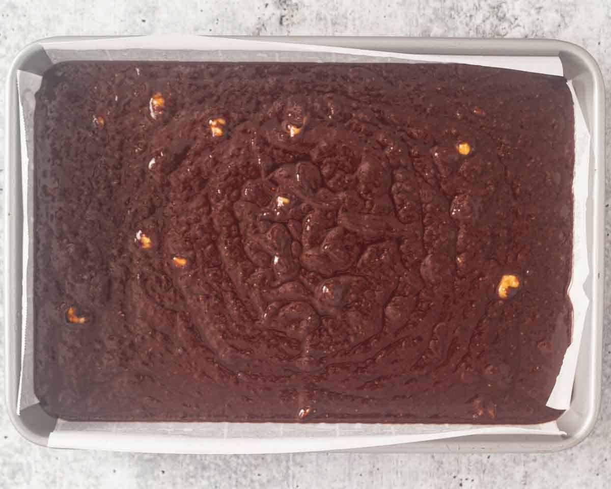 brownie mixture in the bakin pan before baking