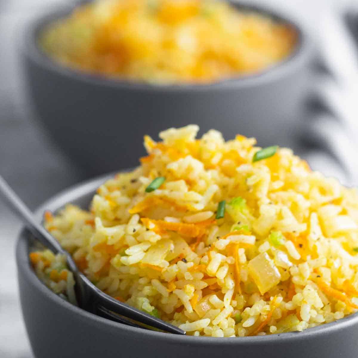 two bowls served with rice and carrots