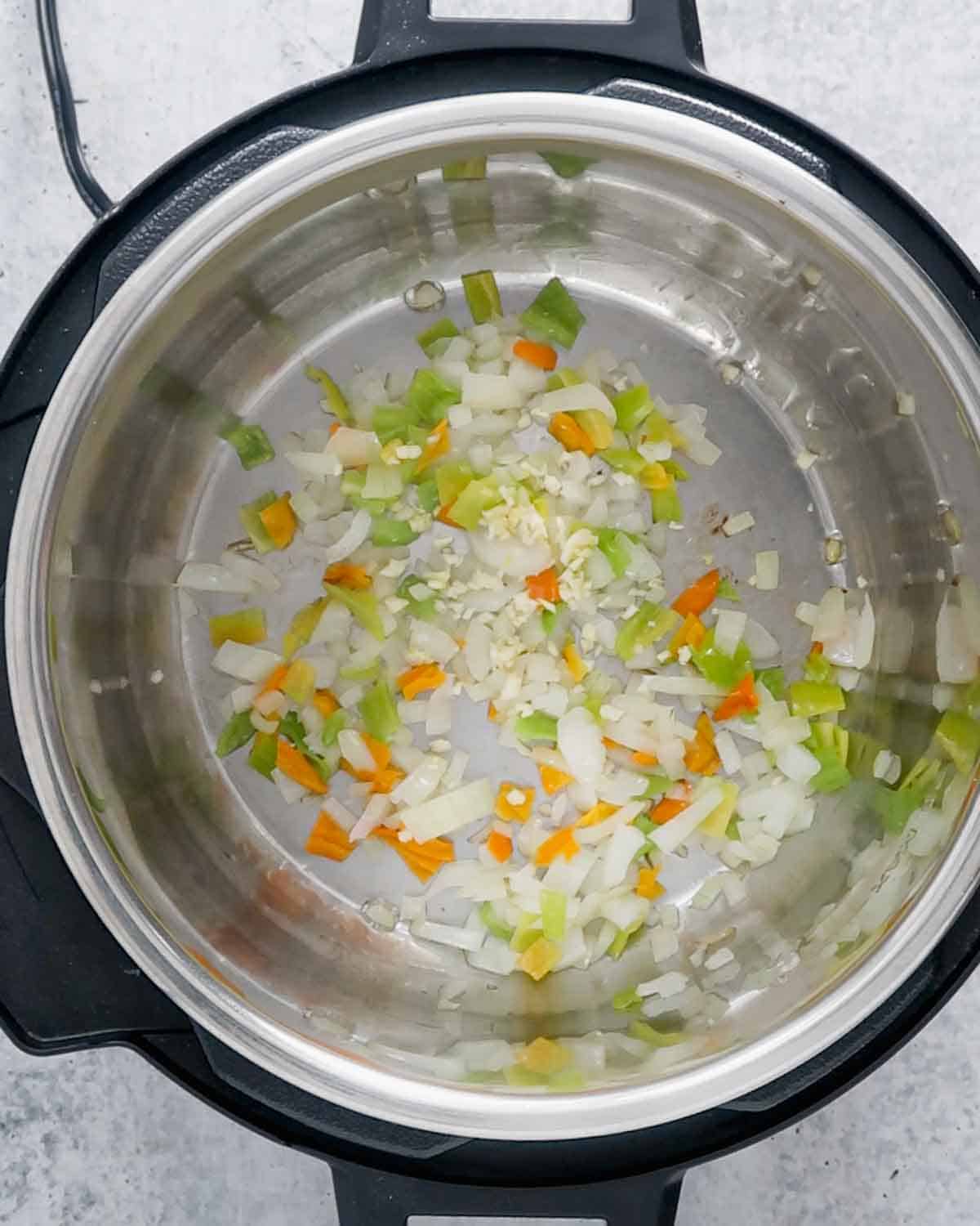 Sautéed veggies inside and Instant pot.