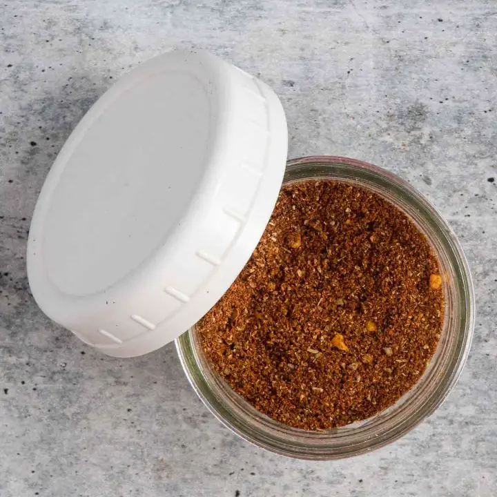 A top view of a mason jar with chili seasoning mix in it.