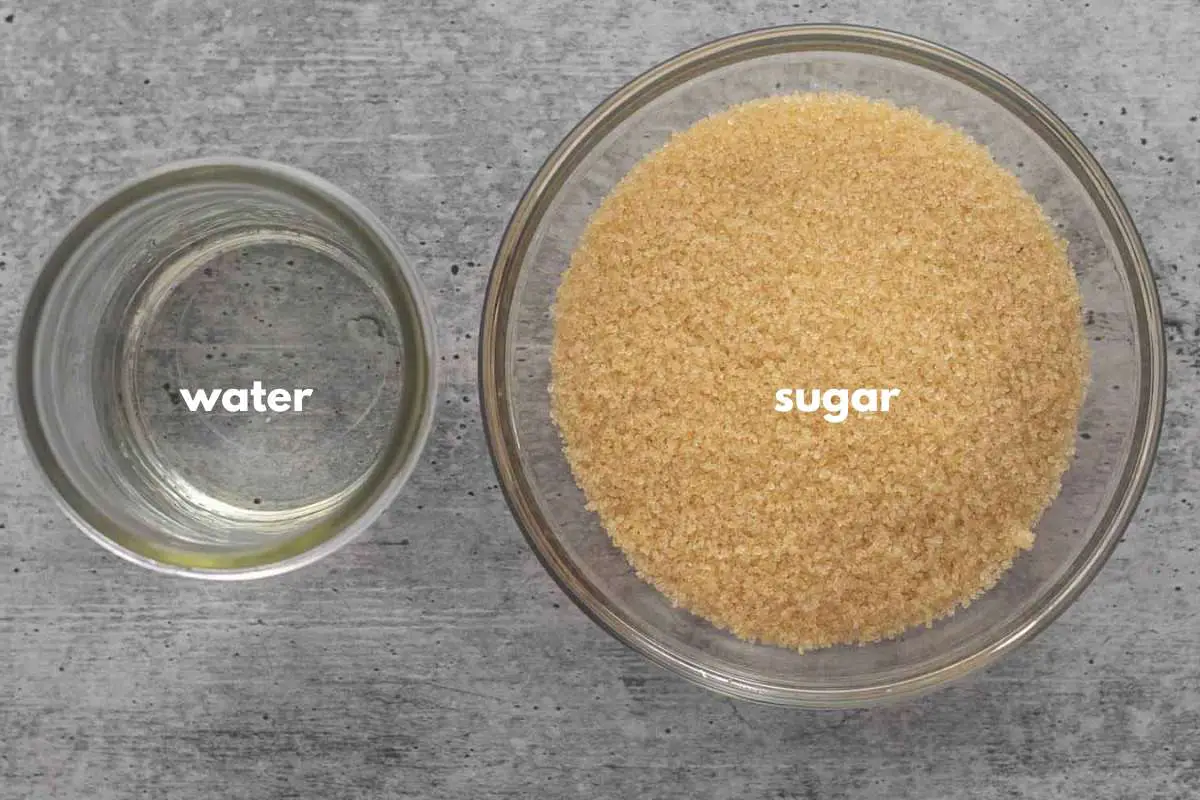 Water and sugar are portioned in individual containers to make caramel sauce.