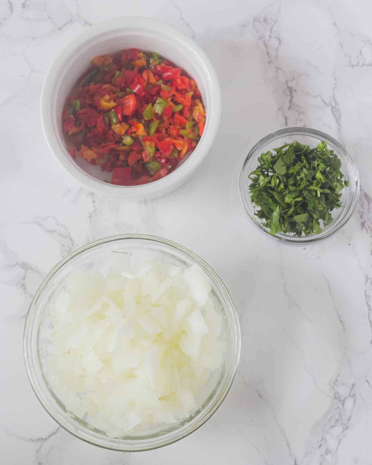 Sofrito ingredients chopped portioned.